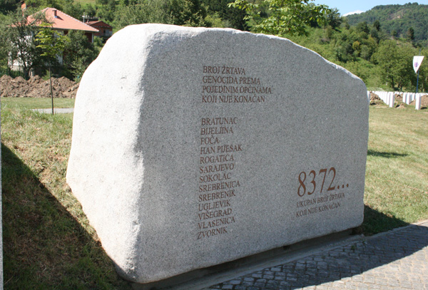 image of a stone memorial to the victims of the Bosnian Genocide at Srebrenica