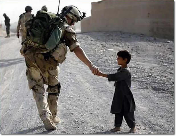 nato soldier greeting children in afghanistan